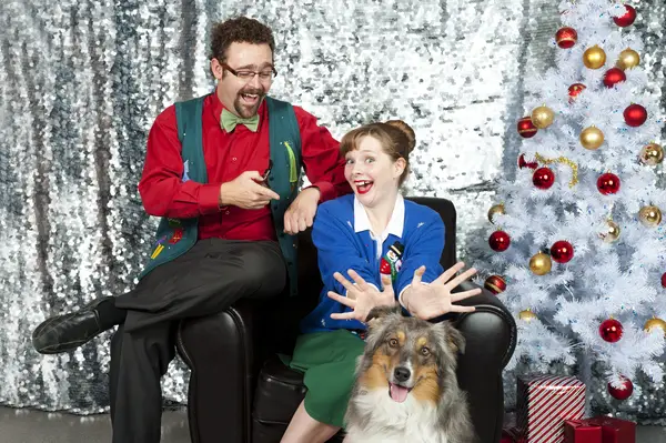 A funny Christmas portrait of a couple and their dog, one way to create an annual holiday tradition with your dog.